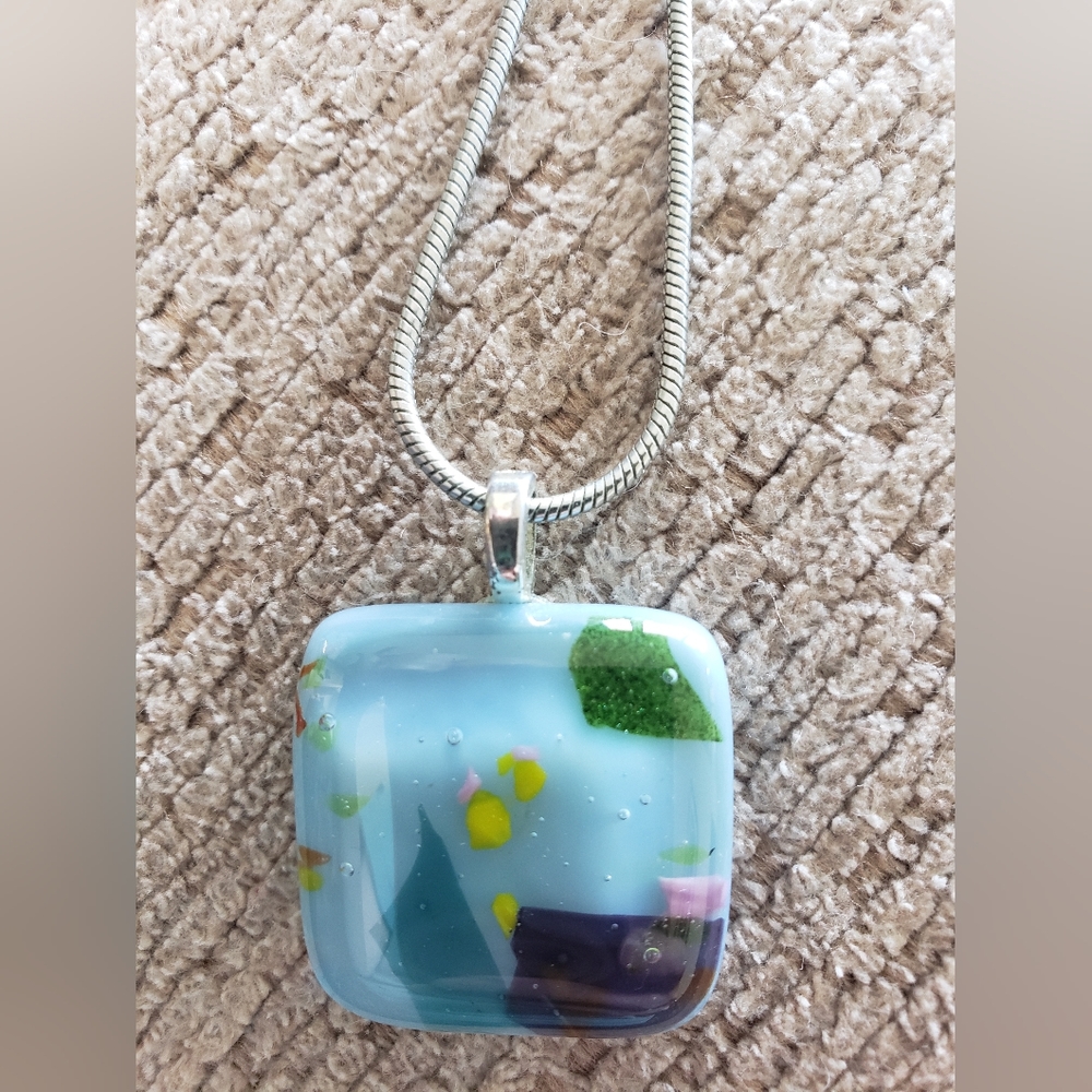 Fused glass pendant with silver chain.